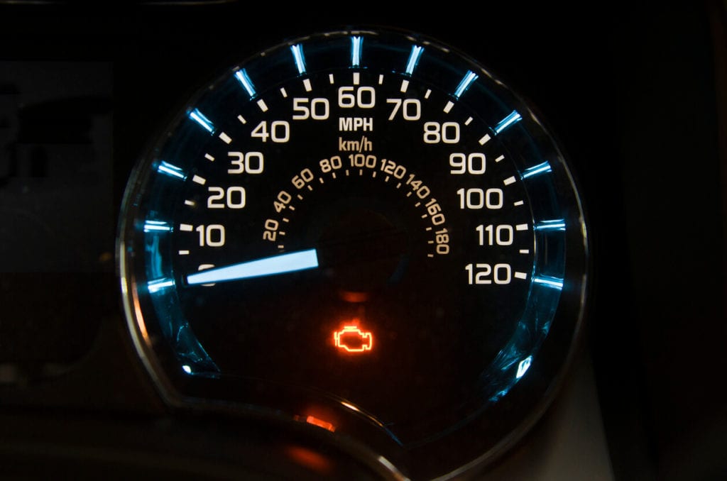 vehicle speedometer with check emgine light on