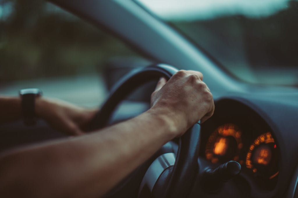 Driver holding steering wheel 