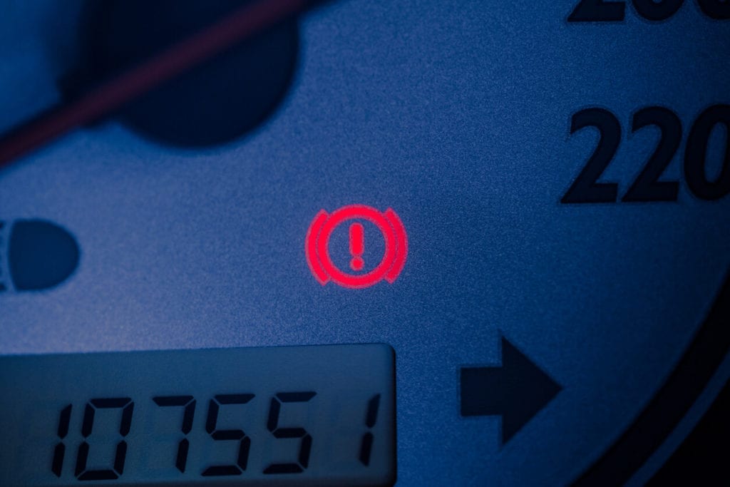 Handbrake warning light sign illuminated