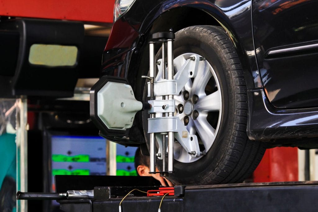 car wheel fixed with computerized wheel alignment machine clamp