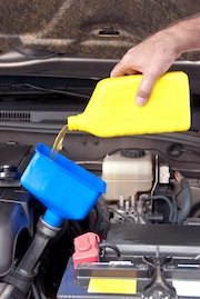 technician performing an oil change in georgetown, tx