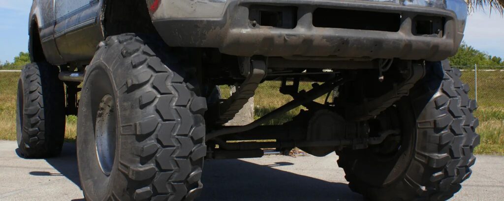 Close-up of a lifted truck with oversized off-road tires